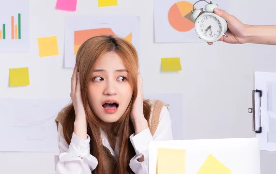 Young worker being pressured by a manager holding a clock