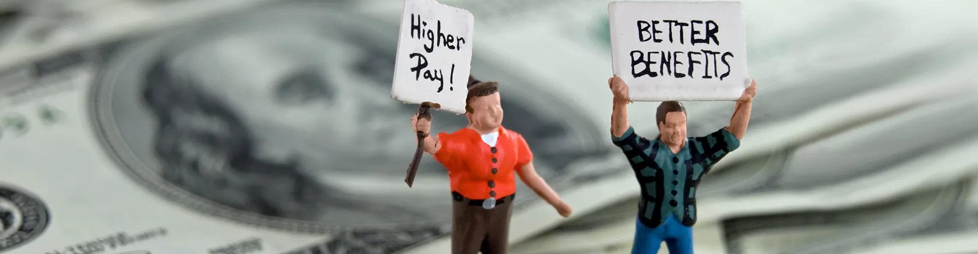 Clay characters holding signs