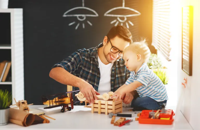 Dad and son playing with blocks