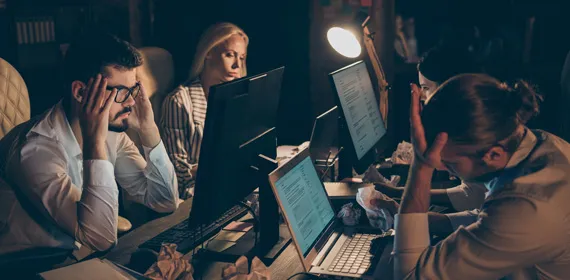Businesspeople brainstorming late night